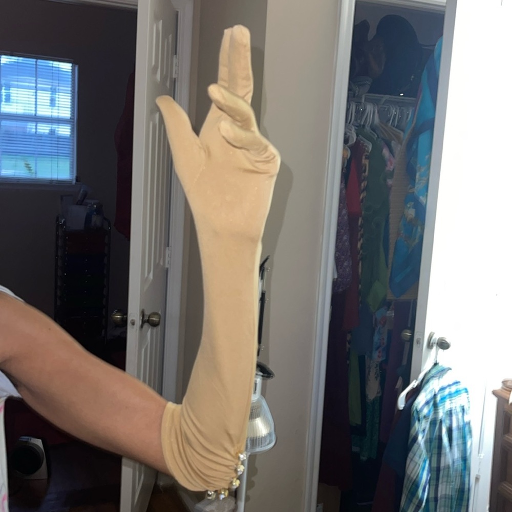 Long Formal Wear Gloves with Rhinestones. They have a gold shimmer to them